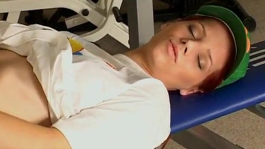 Nubile Gabriella uses a massager on herself in the gym